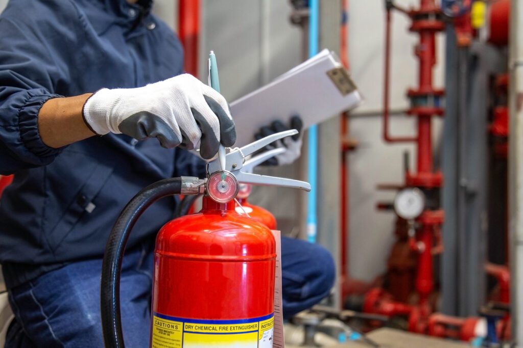 Fire safety equipment being inspected